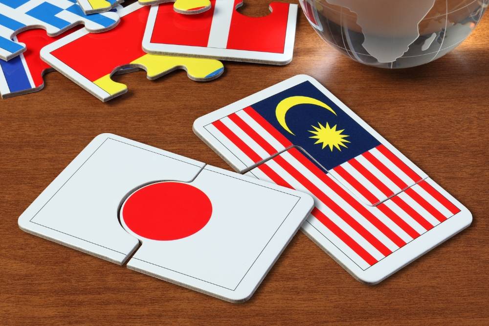 While Malaysia and Japan share a common struggle with overworking culture, the reasons behind it differ. Photo: Edited via Canva