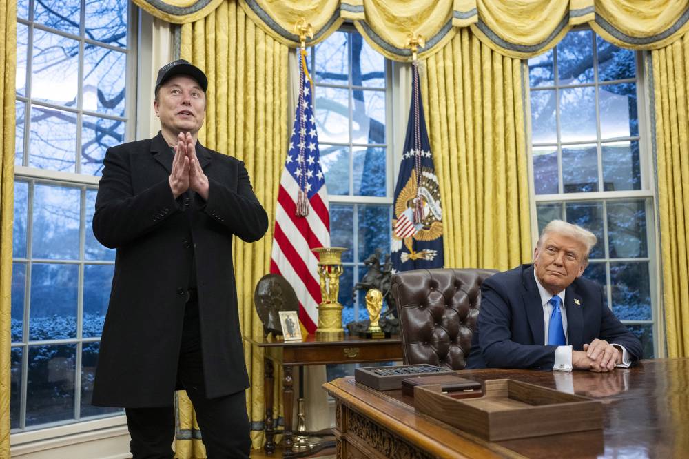 Elon Musk speaks as US President Donald Trump looks on in the Oval Office of the White House in Washington, DC, on Feb 11, 2025. - (Photo by JIM WATSON / AFP)