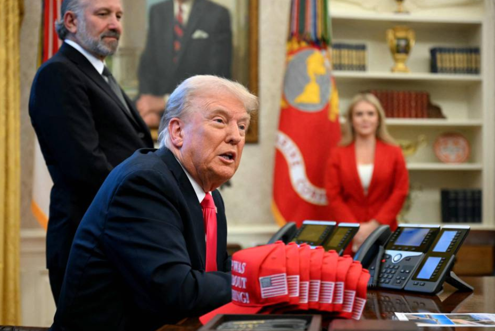 Earlier on Tuesday, the White House said the United States is proceeding with earlier announced tariffs on goods imported from Canada and Mexico. - Photo by Jim Watson/AFP