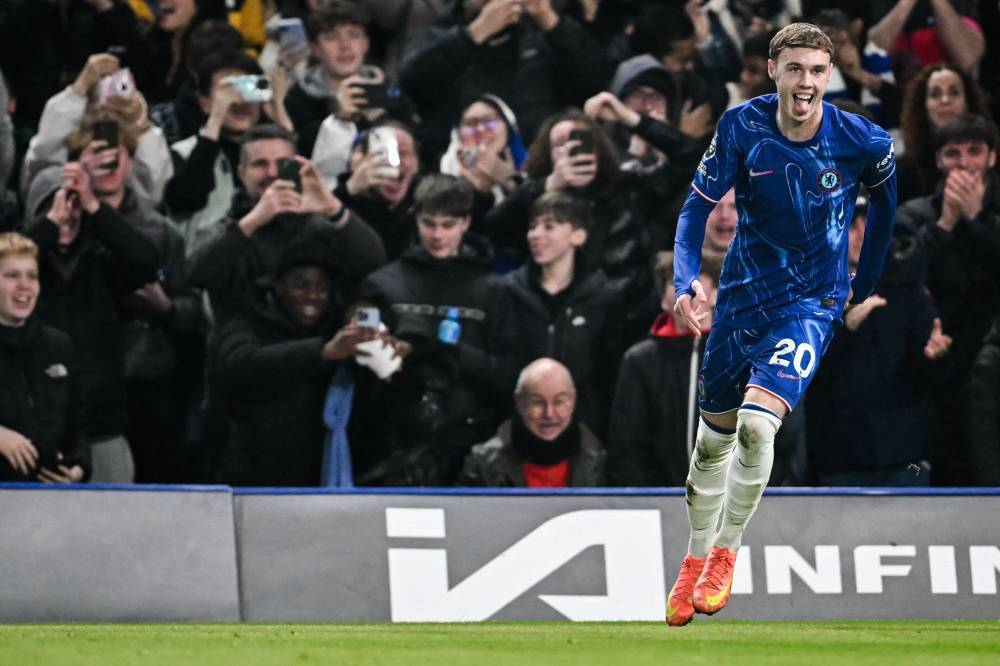 Chelsea's English midfielder Cole Palmer celebrates after scoring his team first goal during the English Premier League football match between Chelsea and Bournemouth at Stamford Bridge in London on January 14, 2025. (Photo by JUSTIN TALLIS/AFP)
