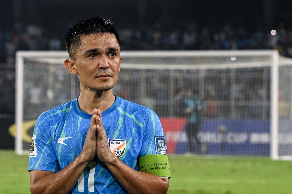 India's captain Sunil Chhetri greets his fans at the end of the FIFA World Cup 2026 Asia qualifier match between India and Kuwait at the Salt Lake Stadium in Kolkata on June 6, 2024. (Photo by DIBYANGSHU SARKAR / AFP)