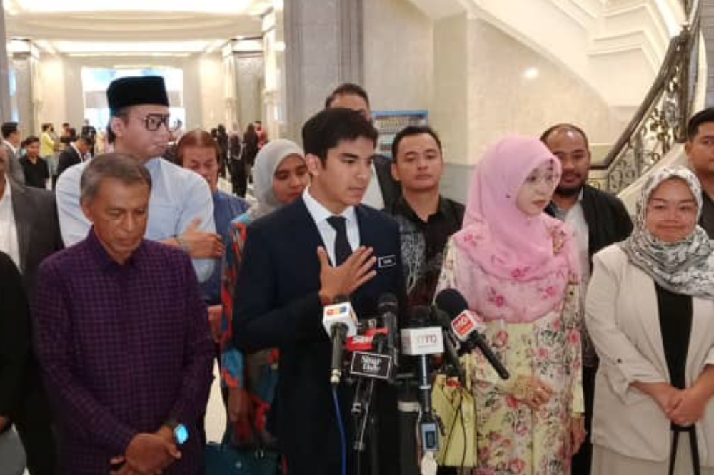 Syed Saddiq during a press conference at the lobby of the Palace of Justice, today.
