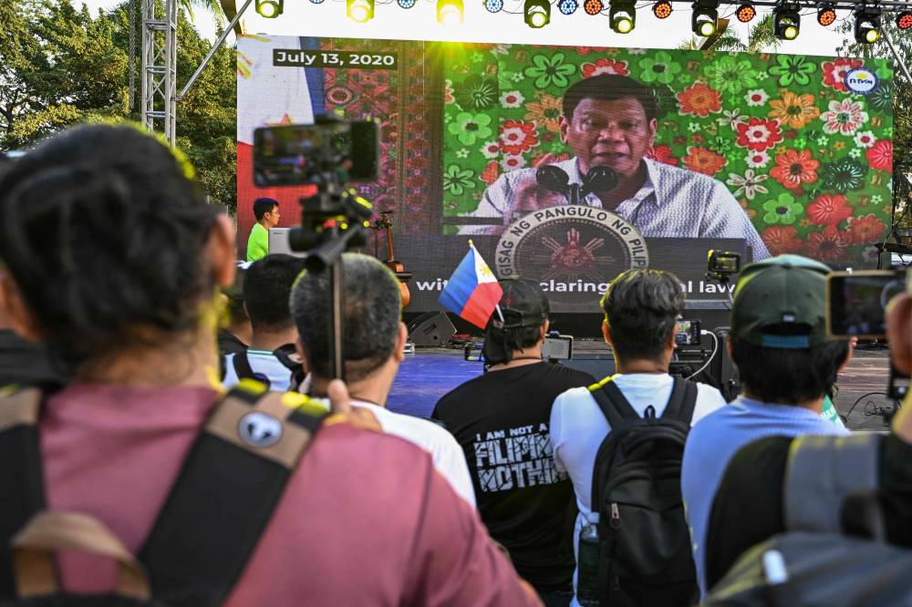 Philippines' former president Rodrigo Duterte's supporters gather for a prayer rally at Liwasang Bonifacio in Manila on March 15, 2025, as he faces crimes against humanity charges over his deadly crackdown on narcotics. Former Philippine president Rodrigo Duterte failed to attend in person an initial hearing at the International Criminal Court on March 14. The 79-year-old, the first ex-Asian head of state charged by the ICC, followed by videolink during a short hearing to inform him of the crimes he is alleged to have committed, as well as his rights as a defendant. (Photo by Jam STA ROSA / AFP)