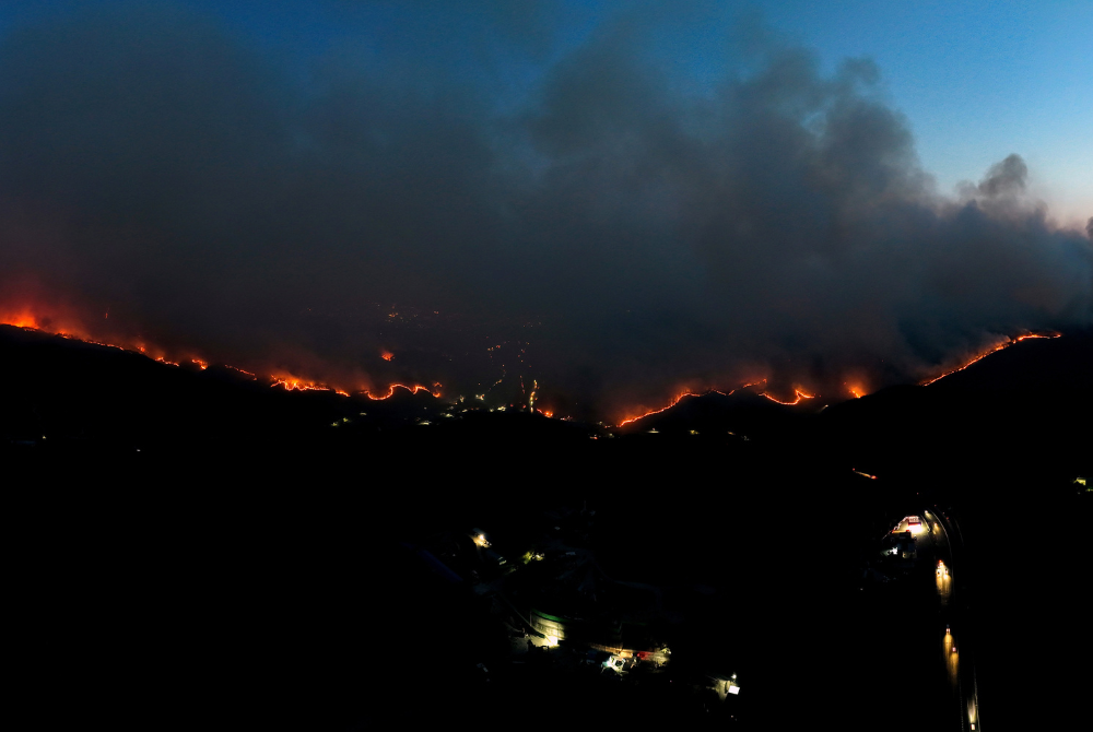 This photo taken on March 22, 2025 shows a wildfire in North Gyeongsang province, South Korea. (NEWSIS via Xinhua)