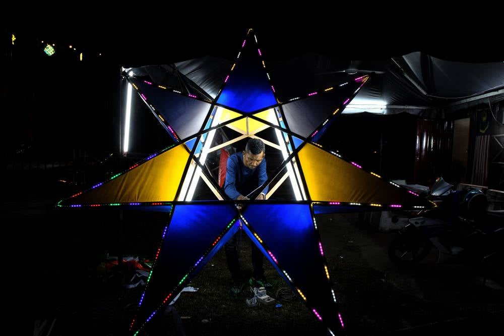 Wan Shaiful Rizal Wan Sulong said he chose to make giant stars as they received a positive response and were easier to produce compared to the smaller, more intricate ones. Photo by Bernama