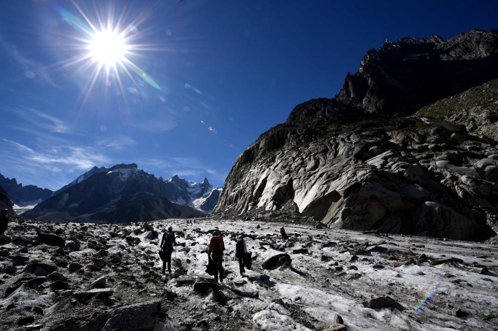 The accelerated melting of glaciers due to global warming is leading to the creation of new lakes, some of which can threaten human lives downstream, particularly in the Alps, where the authorities are trying to contain the risk. (Photo by Jean-Pierre CLATOT / AFP)