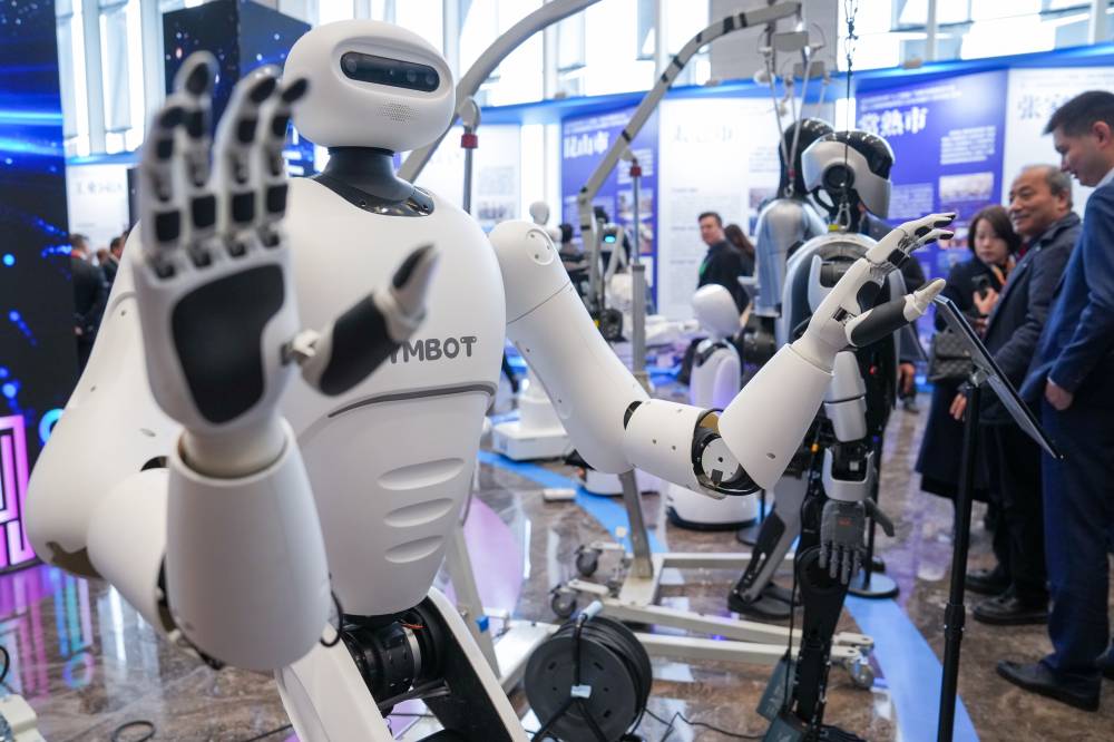 A humanoid robot is pictured during an innovative development promotion conference focusing on artificial intelligence in Suzhou City, east China's Jiangsu Province, Feb. 14, 2025. (Photo by Xinhua/Li Bo)
