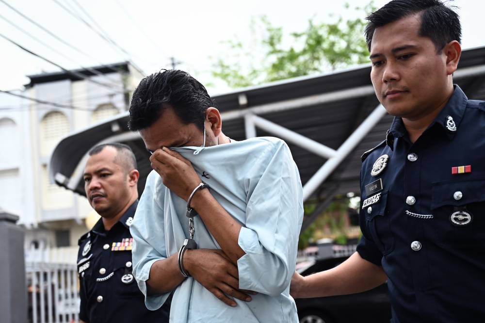 A lecturer at a local skills institute was charged at the Kemaman Sessions Court today with eight counts of committing sexual acts involving objects and unnatural intercourse with two of his students last year. - Photo by Bernama