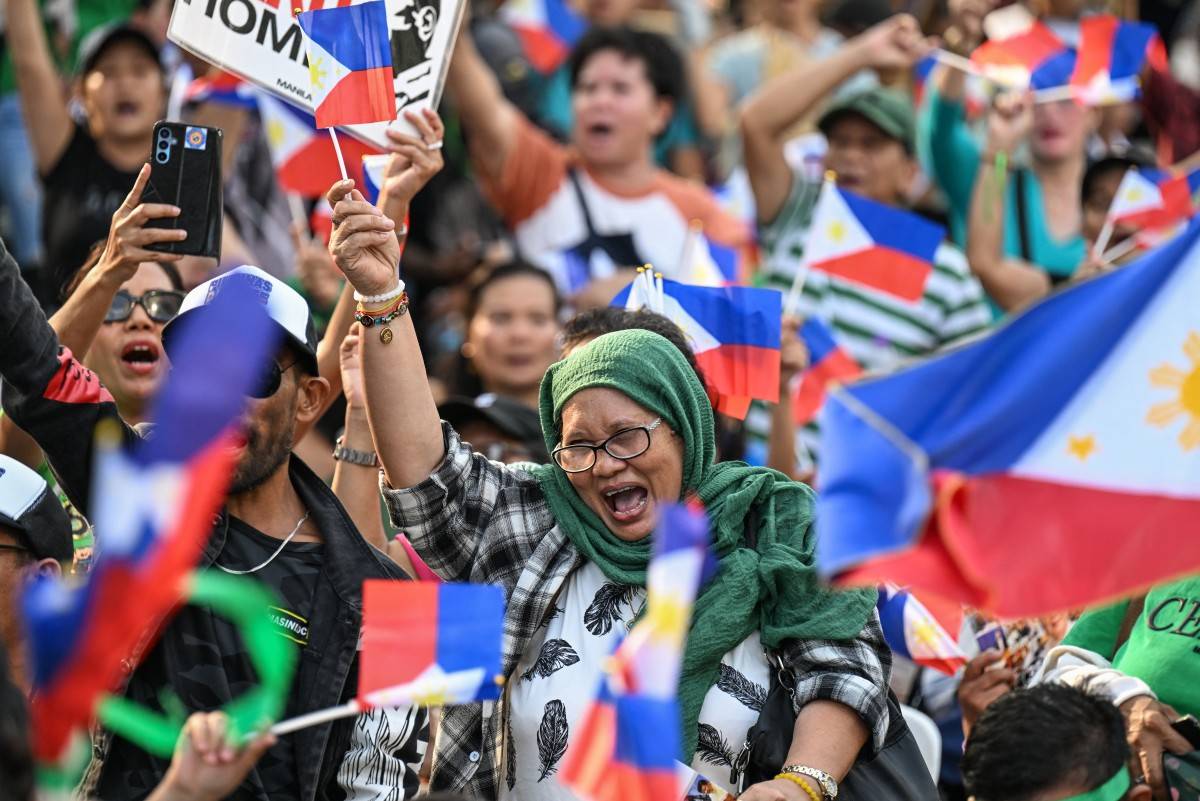Philippines' former president Rodrigo Duterte's supporters gather for a prayer rally at Liwasang Bonifacio in Manila on March 15, 2025, as he faces crimes against humanity charges over his deadly crackdown on narcotics. Former Philippine president Rodrigo Duterte failed to attend in person an initial hearing at the International Criminal Court on March 14. (Photo by Jam STA ROSA / AFP)