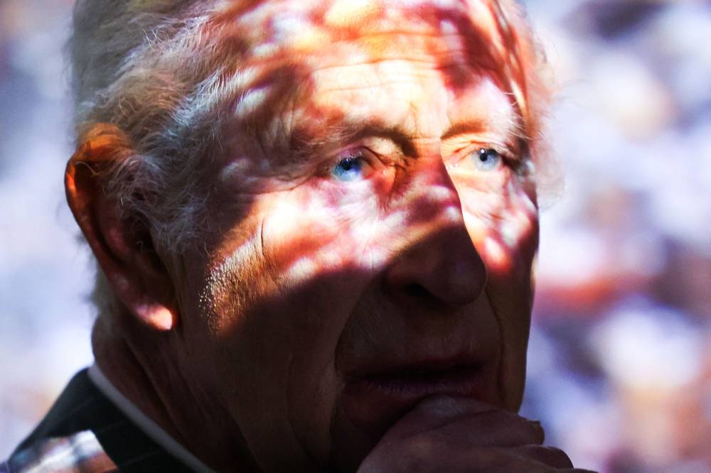 Britain's King Charles III reacts during a visit of the exhibition 