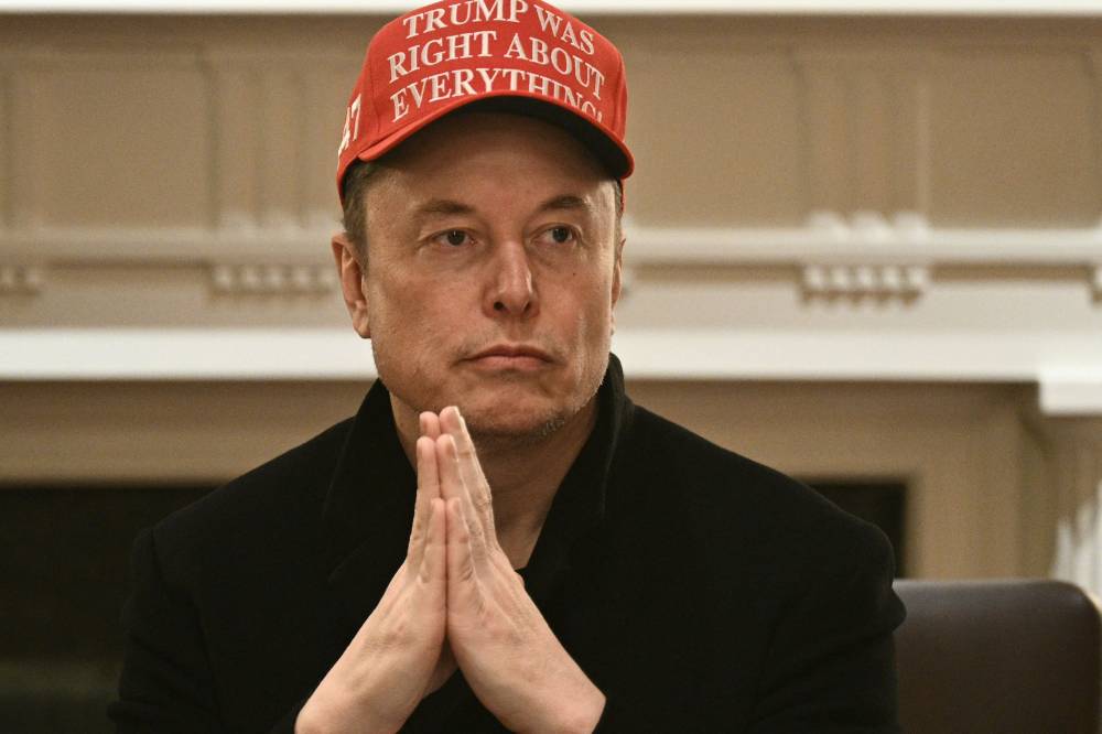Elon Musk looks on as US President Donald Trump hosts a cabinet meeting in the Cabinet Room of the White House on March 24, 2025, in Washington, DC. - (Photo by Brendan SMIALOWSKI / AFP)