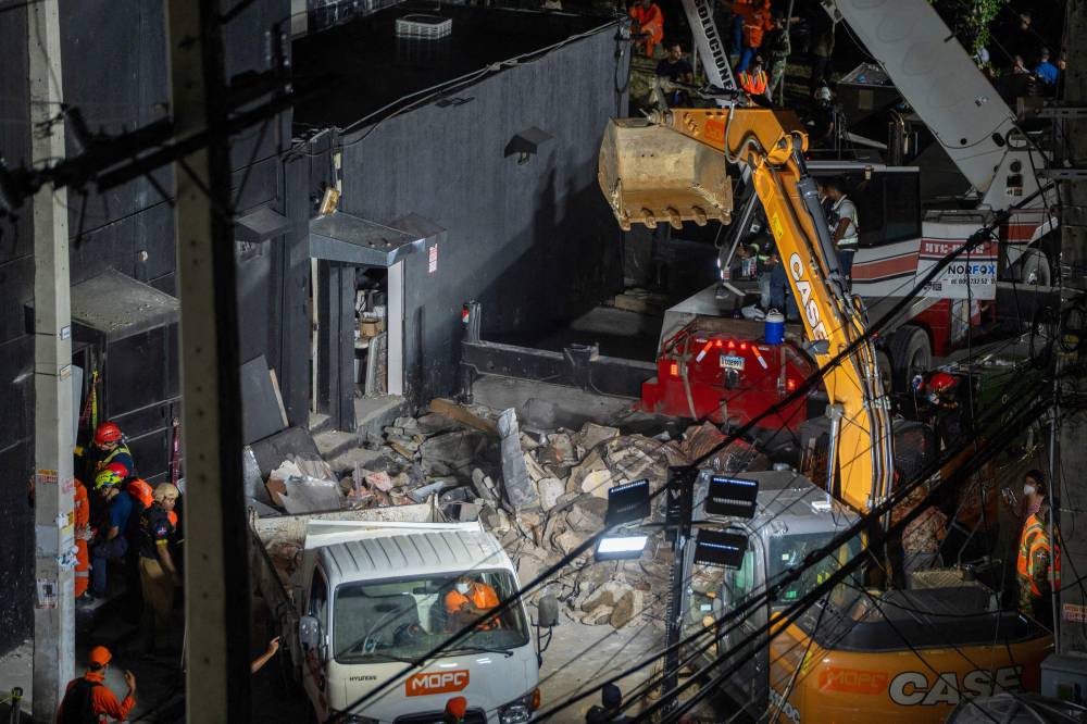 Rescue teams work at the Jet Set nightclub following the collapse of its roof in Santo Domingo. Photo by Francesco Spotorno/AFP