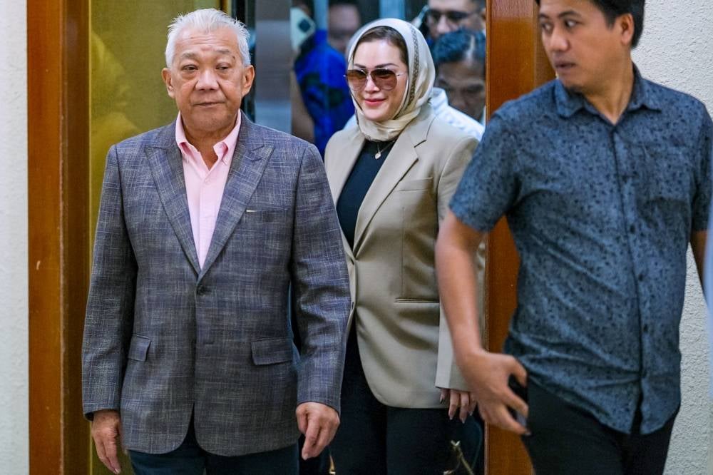 Kinabatangan MP Datuk Seri Bung Moktar Radin and his wife, Datin Seri Zizie Izette Abdul Samad at the Kuala Lumpur Courts Complex, today. - Photo by Bernama