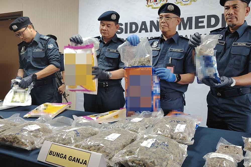 Taufik (second from right) reveals the syndicate's tactic of hiding cannabis flowers in pet food packages.