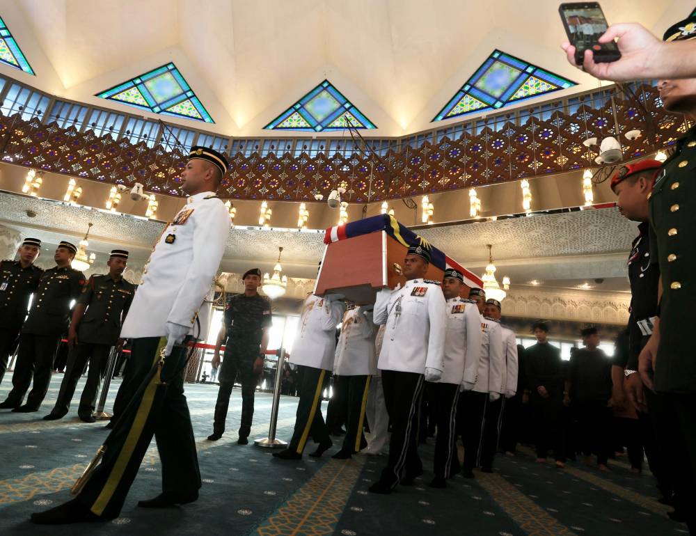 The remains of the late fifth Prime Minister Tun Abdullah Ahmad Badawi was carried in before being placed in the main prayer hall of the National Mosque, today. - Photo by Bernama