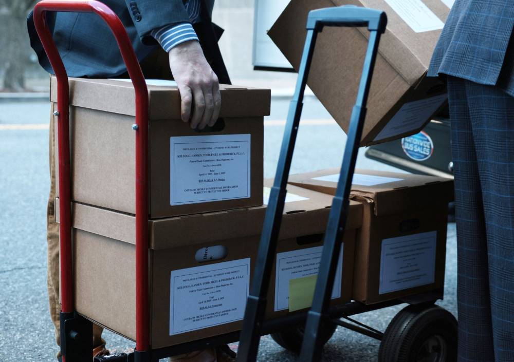 Boxes labeled "Federal Trade Commission v. Meta Platforms, Inc." are being loaded into a vehicle outside the E. Barrett Prettyman United States Court House on April 16, 2025 in Washington, DC. - (Photo by ALEX WONG / AFP)