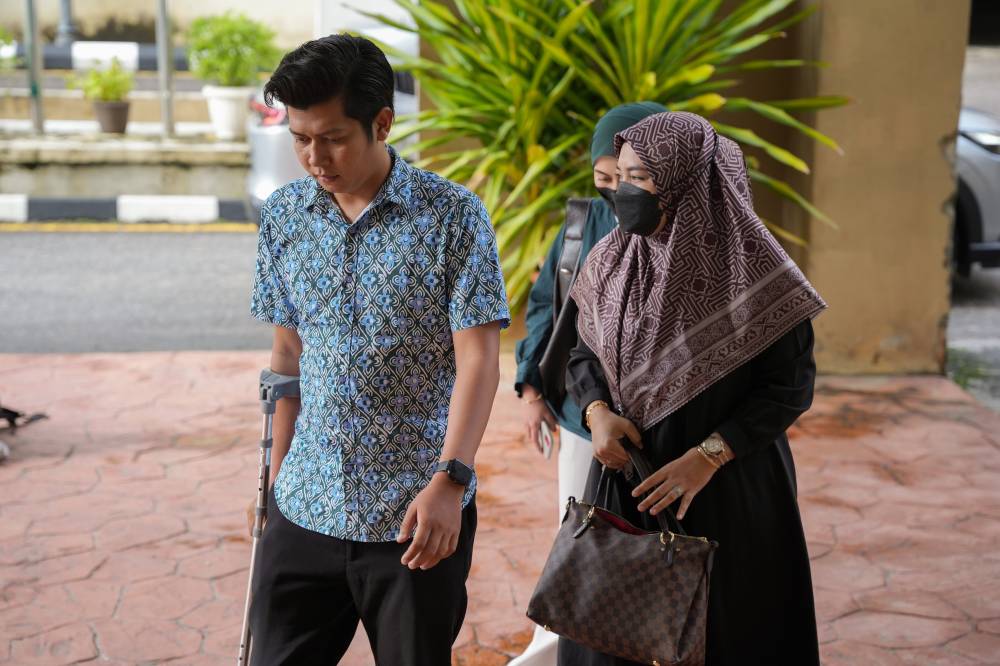 Zayn Rayyan's parents, Zaim Ikhwan Zahari and Ismanira Abdul Manaf, were present at the Petaling Jaya Sessions Court today for the continuation of the hearing in their child neglect case involving their six-year-old autistic son. Photo by Bernama