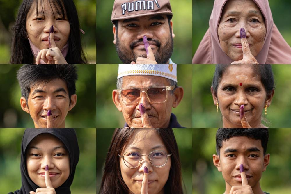 Compilation of photos of voters who have completed their voting responsibilities in the Ayer Kuning State Legislative Assembly (DUN) by-election at Sekolah Menengah Kebangsaan Bidor today. Photo by Bernama