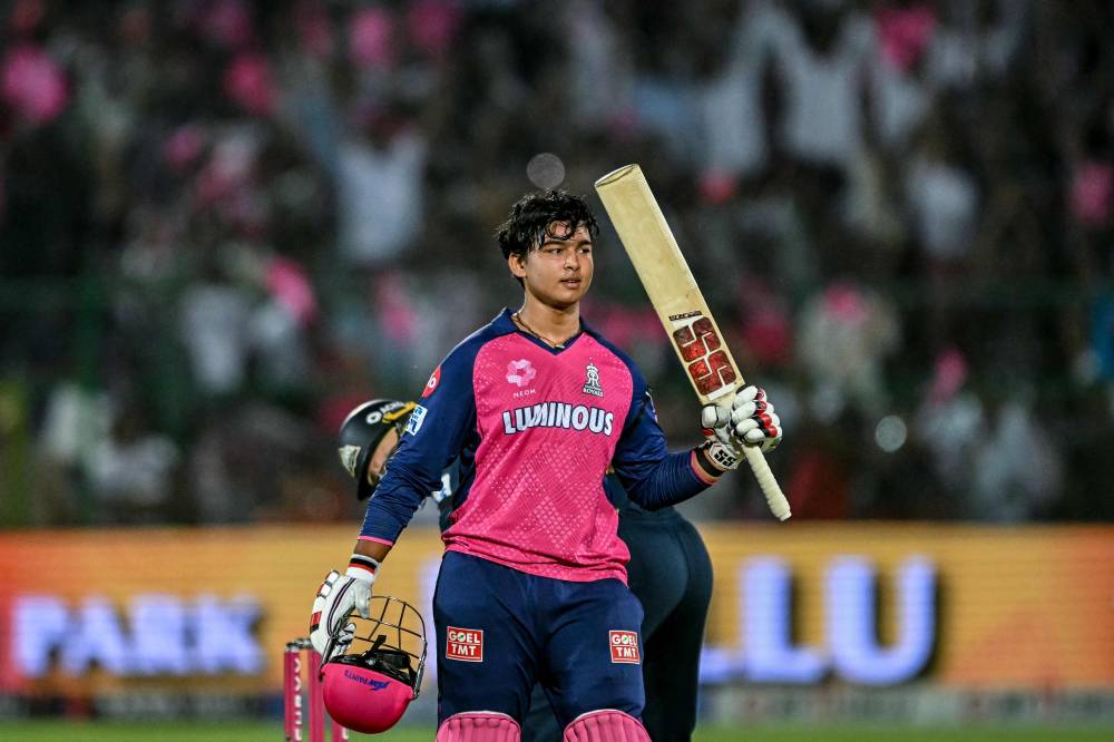 Rajasthan Royals' Vaibhav Suryavanshi celebrates after scoring a century (100 runs) during the Indian Premier League (IPL) Twenty20 cricket match between Rajasthan Royals and Gujarat Titans at the Sawai Mansingh Stadium in Jaipur on April 28, 2025. (Photo by Sajjad HUSSAIN/AFP)