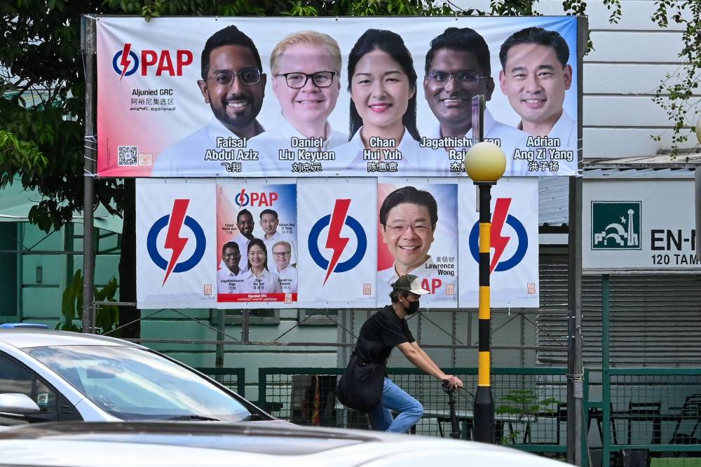 Election campaign posters for the ruling People's Action Party are pictured in Singapore on Apr 30, 2025. Photo by Roslan Rahman/ AFP