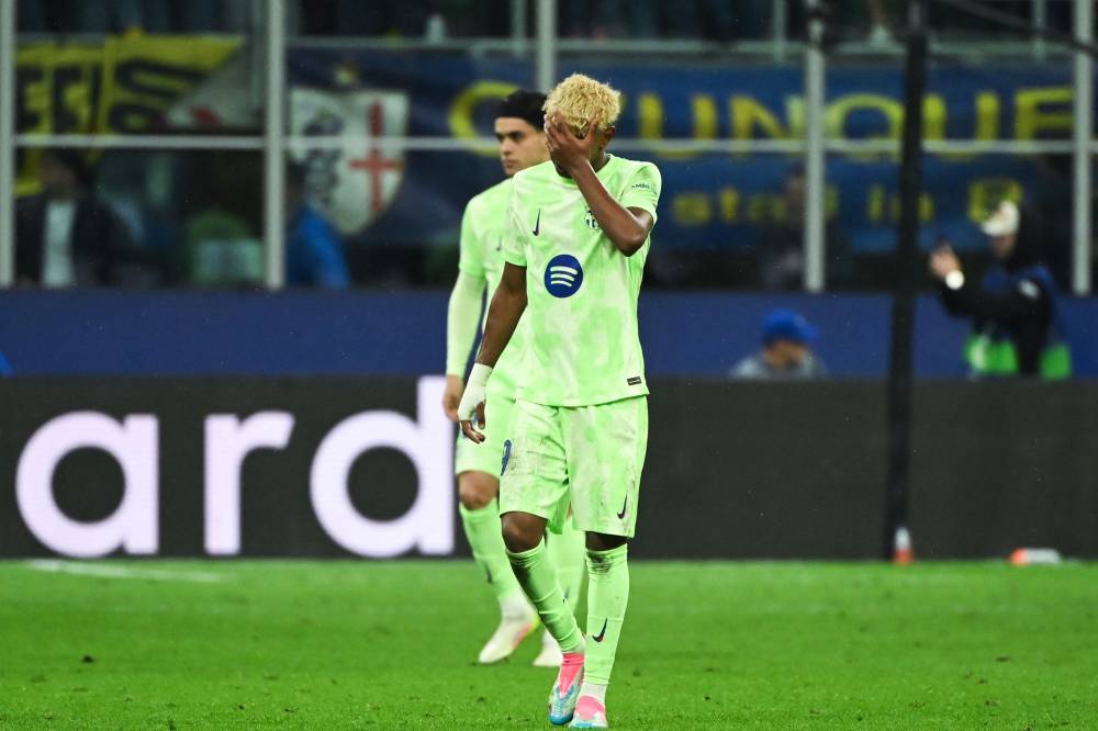 Barcelona's Spanish forward #19 Lamine Yamal reacts after Inter Milan's Italian midfielder #16 Davide Frattesi scored his team fourth goal during the UEFA Champions League semi-final second leg football match between Inter Milan and FC Barcelona at the San Siro stadium in Milan on May 6, 2025. (Photo by PIERO CRUCIATTI / AFP)