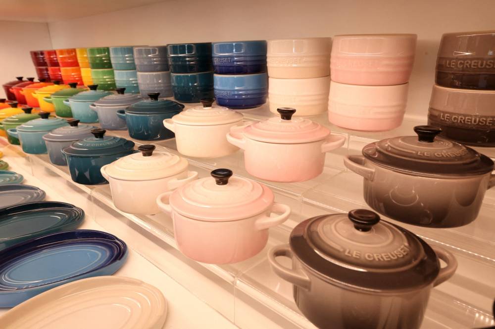 Cookwares are displayed at the store of Le Creuset foundry during a press visit to mark the brand's 100th anniversary in Fresnoy-le-Grand, on April 29, 2025. - (Photo by FRANCOIS LO PRESTI / AFP)