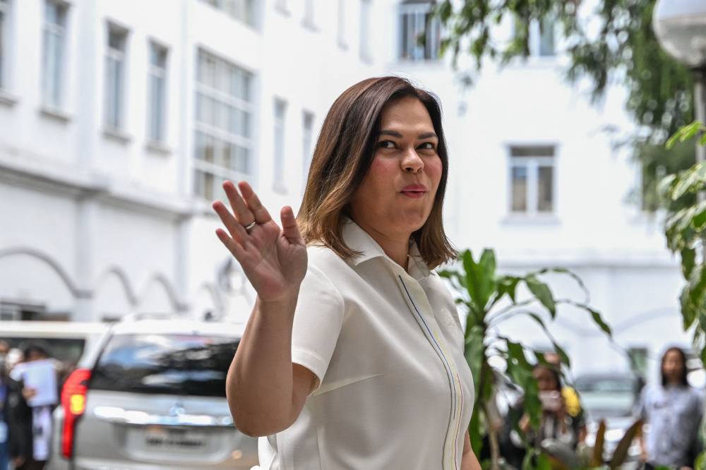 Philippine Vice President Sara Duterte arrives to file her counter affidavit in response to the National Bureau of Investigation complaint over her alleged threat to Philippine President Ferdinand Marcos Jr, at the Department of Justice in Manila on May 9, 2025. - (Photo by JAM STA ROSA / AFP)