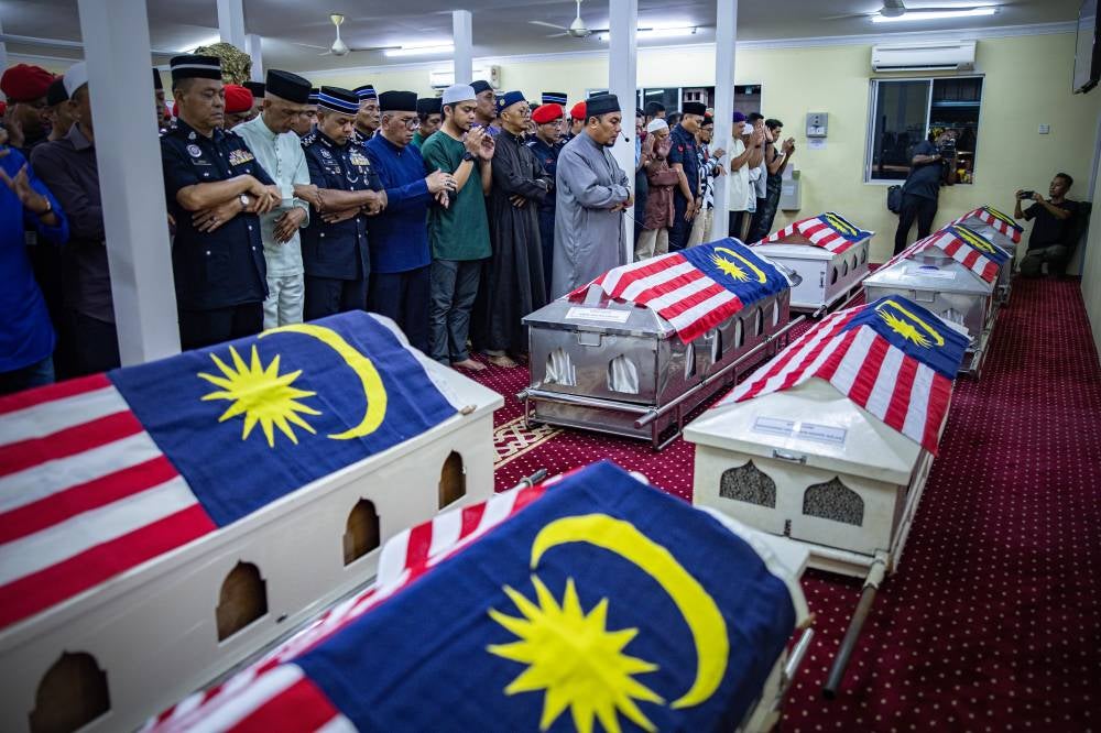 The deceased were identified as Sergeant S Perumal, 44; Corporal Nurit Pandak, 34; Corporal Amiruddin Zabri, 38; Corporal Mohd Pozli Jaudin, 41; Corporal Akmal Muhamad, 35; Corporal Mohamad Hilmi Mohd Azlan, 38; Lance Corporal Damarrulan Abdul Latif, 33; and Constable Akmal Wafi Annuar, 28. Bernama FILE PIX