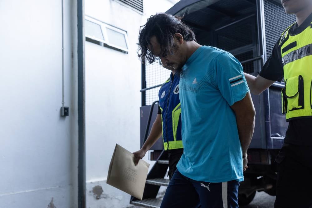 Mohd Izwan Sukarnor, 36, pleaded not guilty in the Sessions Court today, to a charge of stabbing his brother with a stingray tail spine in Kampung Pauh Jabit, Beris Kubur Besar, Bachok, earlier this month. - Photo by Bernama