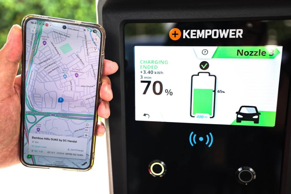 EV user Rosmah Idayu Abu Samah, 48, said although she lives in a condominium and, hence, not able to have her own charger at home, she still believes her decision to switch to an EV about a year ago was the right one. - Bernama photo