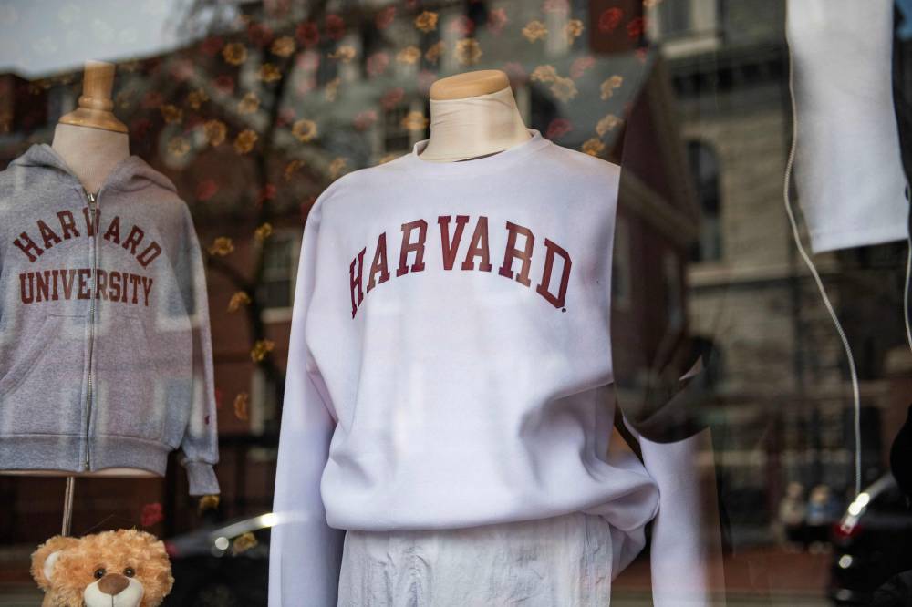 Harvard sweatshirts are displayed for sale in a school store window on the Harvard University campus in Cambridge, Massachusetts, on April 15, 2025. US President Donald Trump's administration on Thursday revoked Harvard's right to enroll foreign students -- more than a quarter of its annual enrollment -- in a major escalation of the president's fight with one of the world's most storied universities. Trump is furious at Harvard -- which has produced 162 Nobel prize winners -- for rejecting his demand that it submit to oversight on admissions and hiring over his claims that it is a hotbed of anti-Semitism and "woke" liberal ideology. Photo by AFP