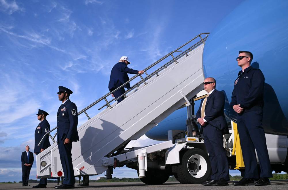 US President Donald Trump boards Air Force One prior to departure from Morristown Municipal Airport in Morristown, New Jersey, May 25, 2025, after spending the weekend in New Jersey. (Photo by SAUL LOEB/AFP)
