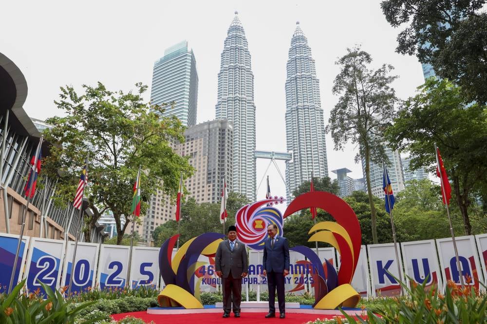 Prime Minister Datuk Seri Anwar Ibrahim (right) poses with the Indonesian President Prabowo Subianto after welcoming the latter to the 46th ASEAN Summit and Related Summits at the Kuala Lumpur Convention Centre, today. - Bernama photo