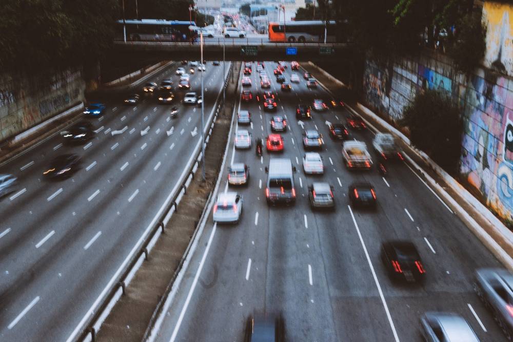 Due to long loan tenures and limited family-friendly public transport, many Malaysians feel compelled to own cars, even if it strains their finances for years. Photo: Edited via Canva