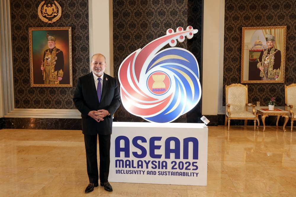His Majesty Sultan Ibrahim, King of Malaysia poses with Asean Summit logo after the Royal Luncheon held in conjunction with the 46th Asean Summit and Related Summits at Istana Negara, yesterday. - Bernama photo