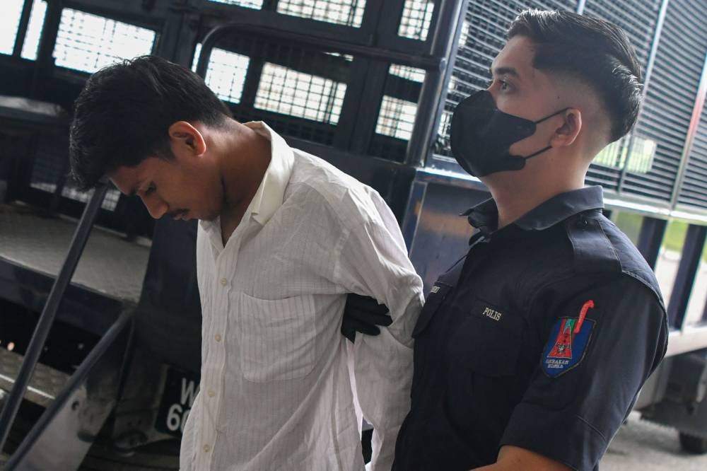 Muhammad Zulhusni Irfan Mohamed, 20, pleaded not guilty in the Sessions Court to charges of robbing six convenience stores early this month in the Pengkalan Chepa and Kota Bharu areas. - Photo by Bernama