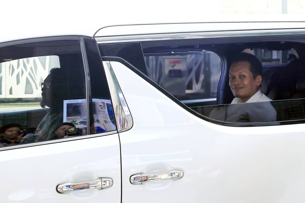 Natural Resources and Environmental Sustainability Minister Nik Nazmi Nik Ahmad leaves his office after announcing his resignation, which will take effect on July 4. - Photo by Bernama