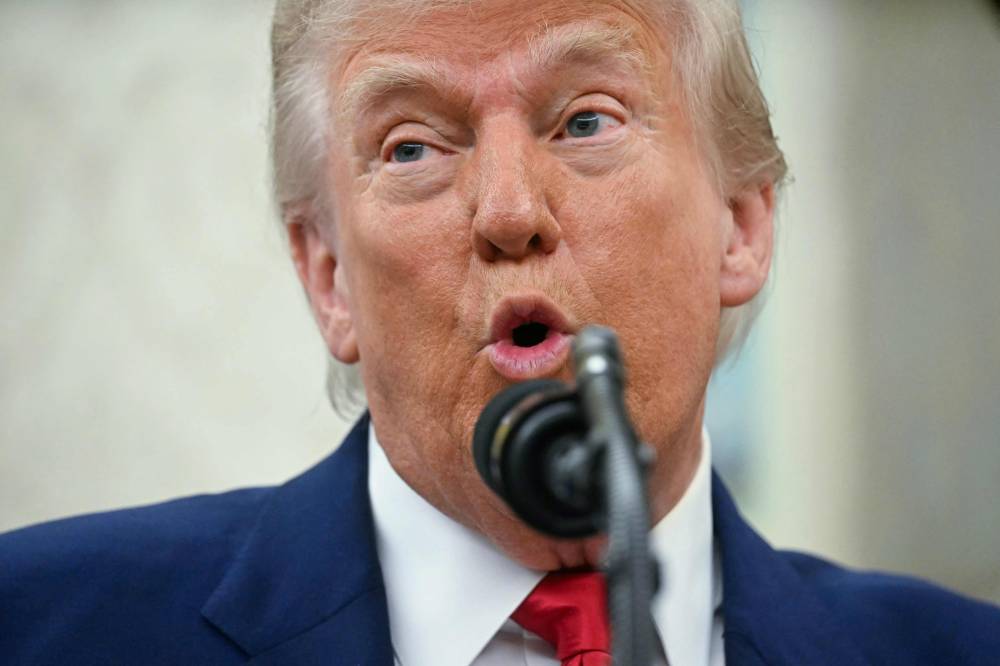 On April 2, Trump signed an executive order that implemented reciprocal tariffs on imports from various countries. (Photo by Jim WATSON / AFP)