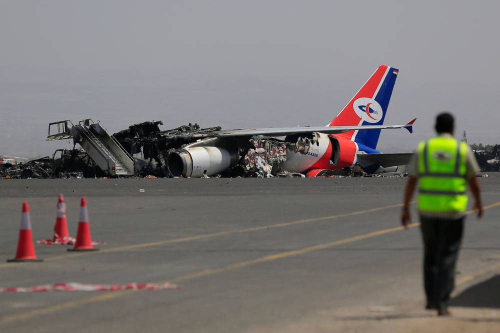 A destroyed airplane lies on the tarmac at Sanaa International Airport on May 29, 2025, in the aftermath of an Israeli military strike. Israeli air strikes blew up the last remaining plane at Yemen's international airport, Israel and a Yemeni official said on May 28, 2025. - (Photo by MOHAMMED HUWAIS / AFP)