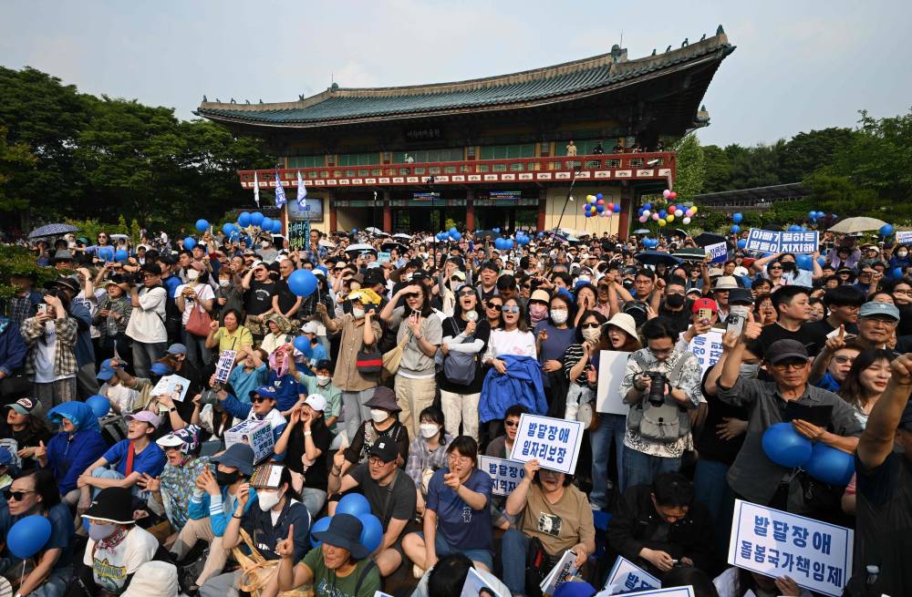 Supporters of South Korean presidential candidate Lee Jae-myung of the Democratic Party gather during an election campaign event for the forthcoming June 3 presidential election in Seoul on May 28, 2025. (Photo by Jung Yeon-je / AFP)