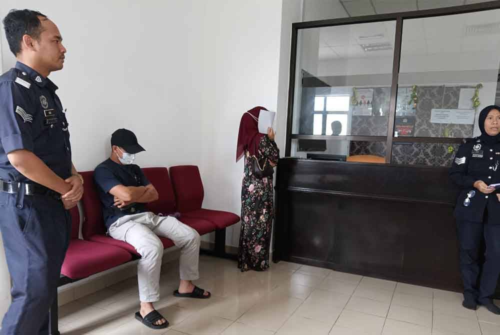 The pair leaving the Syariah High Court here on Friday.