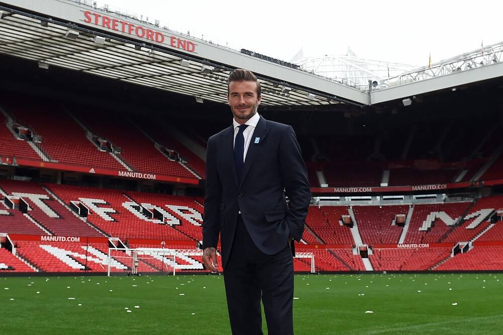 Former Manchester United and England footballer David Beckham poses on the pitch at Old Trafford in Manchester, England, on Oct 6, 2015 ahead of a charity football match in aid of Unicef. Photo: Paul ELLIS / AFP