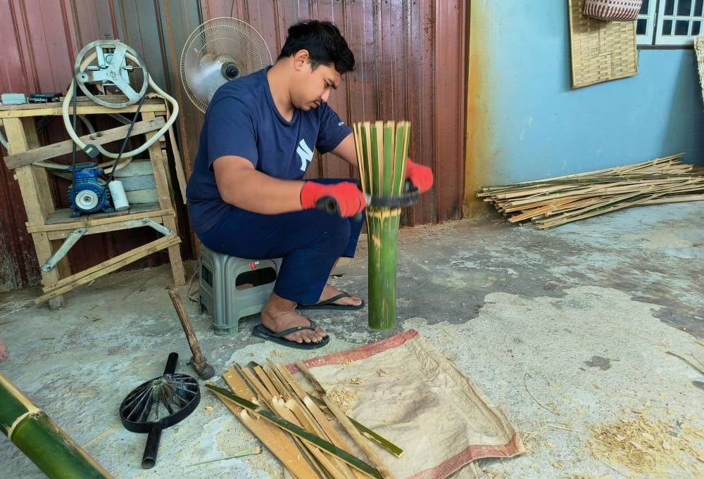 Diniey is also committed to supporting fellow villagers by helping to promote other locally made bamboo crafts such as badang (bamboo trays), baskets, bamboo chimes, food covers and mats. - Bernama photo