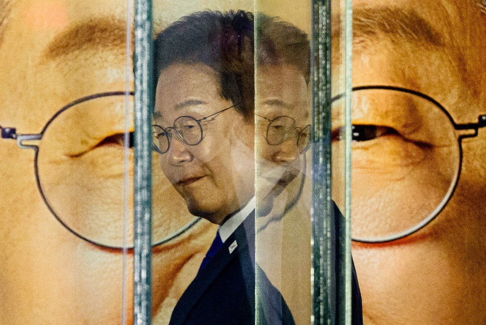 Lee Jae-myung, the presidential candidate for South Korea's Democratic Party, prepares to address supporters as he awaits the final results of the presidential election in Seoul on June 4, 2025. (Photo by ANTHONY WALLACE / AFP)