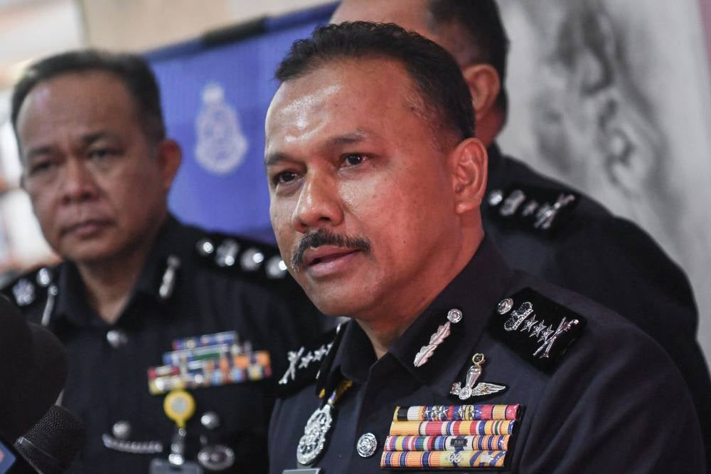 Kelantan Police Chief, Datuk Mohd Yusoff Mamat (right) answers questions from the media during the 2025 Kelantan Police Town Hall Discussion Program titled "Caring for Youth: Preventing Social Issues, Building the Future" at Universiti Malaysia Kelantan (UMK) Kota Campus, Pengkalan Chepa yesterday. - Bernama photo