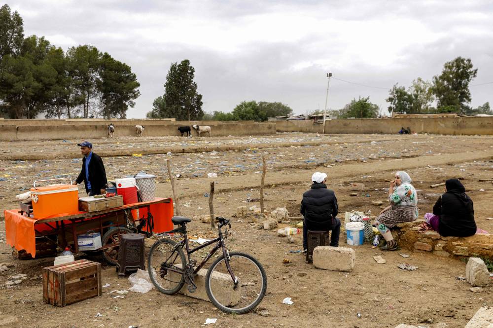 A tea vendor's stall is pictured next to the the empty livestock market square at the weekly market in Khemisset in the Rabat region, about 100 kilometres east of the Moroccan capital, on June 3, 2025. - (Photo by ABDEL MAJID BZIOUAT / AFP)