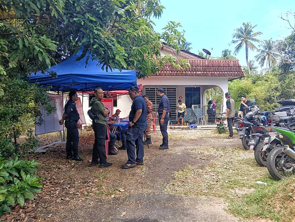 Several enforcement officers were stationed at the search and rescue operations post in Kampung Permatang Pasir on Thursday.
