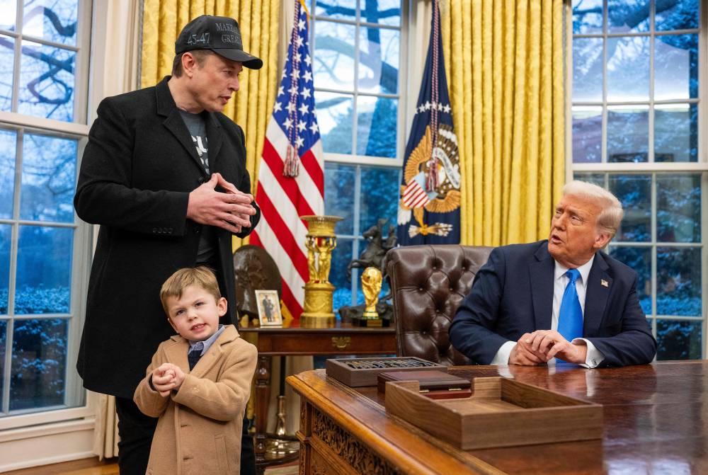 Tesla and SpaceX CEO Elon Musk with his son X A-Xii join US President Donald Trump as he signs executive orders in the Oval Office of the White House in Washington, DC, February 11, 2025. AFP FILE PIX
