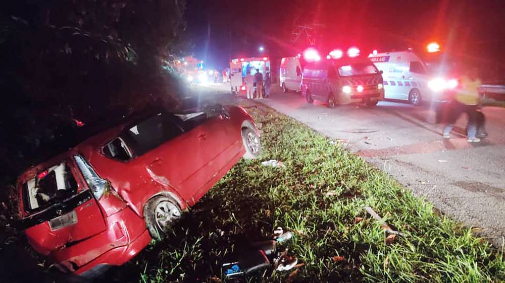 This handout photo taken and released by Perak's Fire and Rescue Department on June 9, 2025 shows a minivan after it collided with a bus in Gerik-Jeli, in Malaysia's Perak state. (Photo by Handout / Perak's Fire and Rescue Department/AFP)