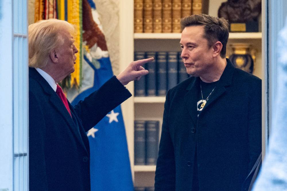 US President Donald Trump and Elon Musk (R) speak in the Oval Office before departing the White House in Washington, DC, on the way to Trump's residence at Mar-a-Lago in Palm Beach, Florida on March 14, 2025. (Photo by ROBERTO SCHMIDT / AFP)